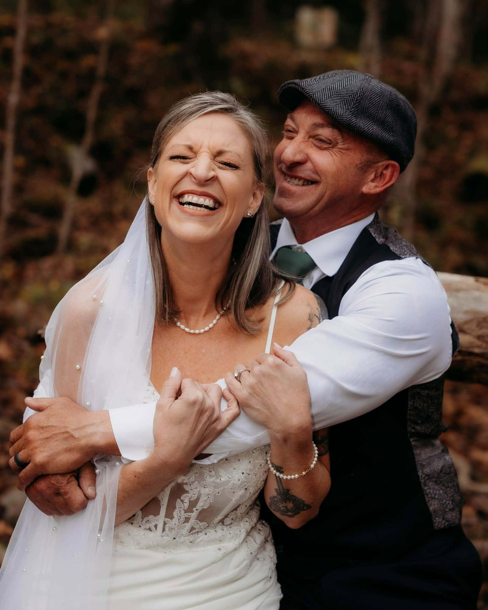 Joyful newlyweds laughing together after their ceremony