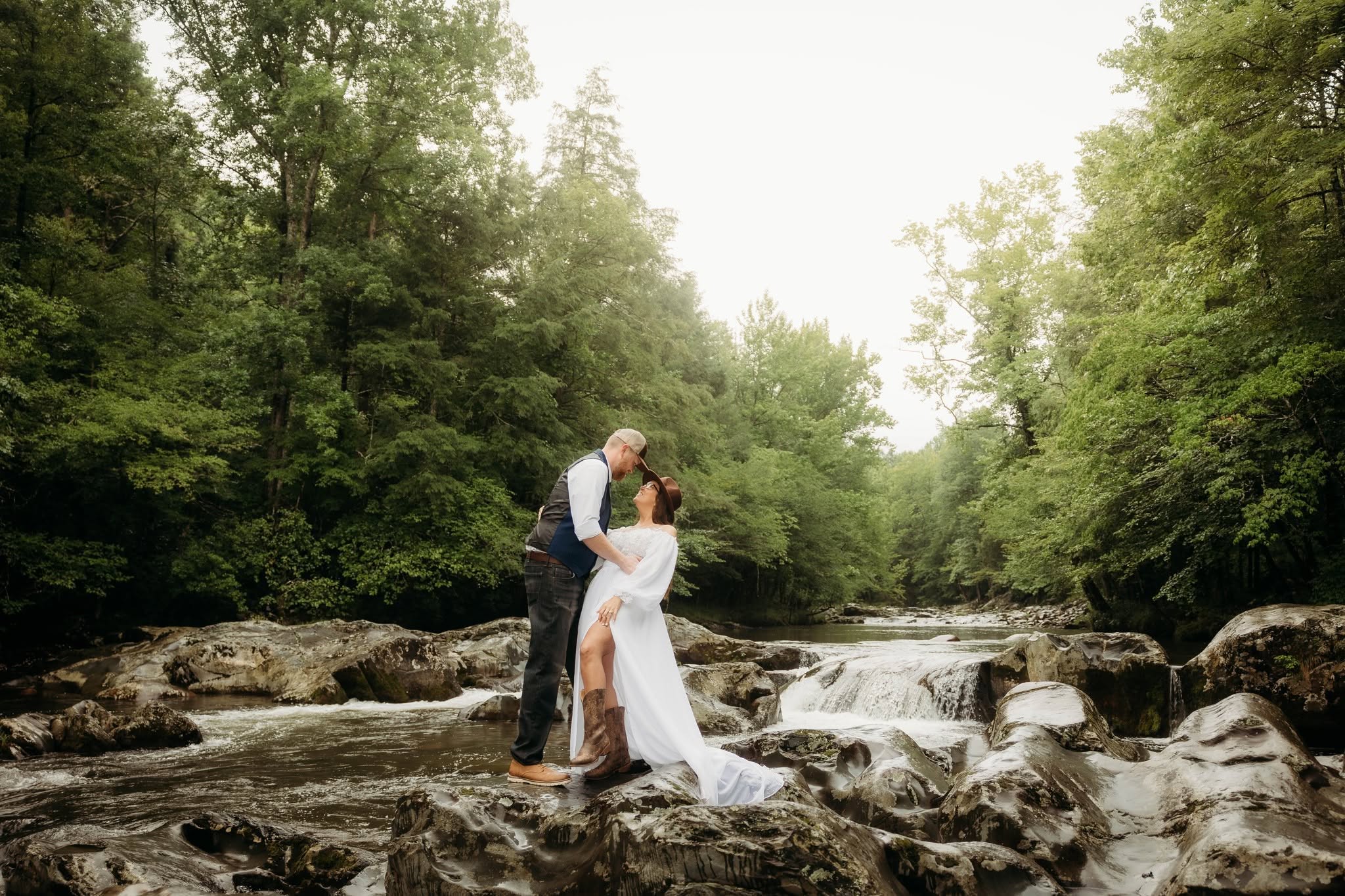 An eloping couple standing in the river at Greenbrier in the Great Smoky Mountains